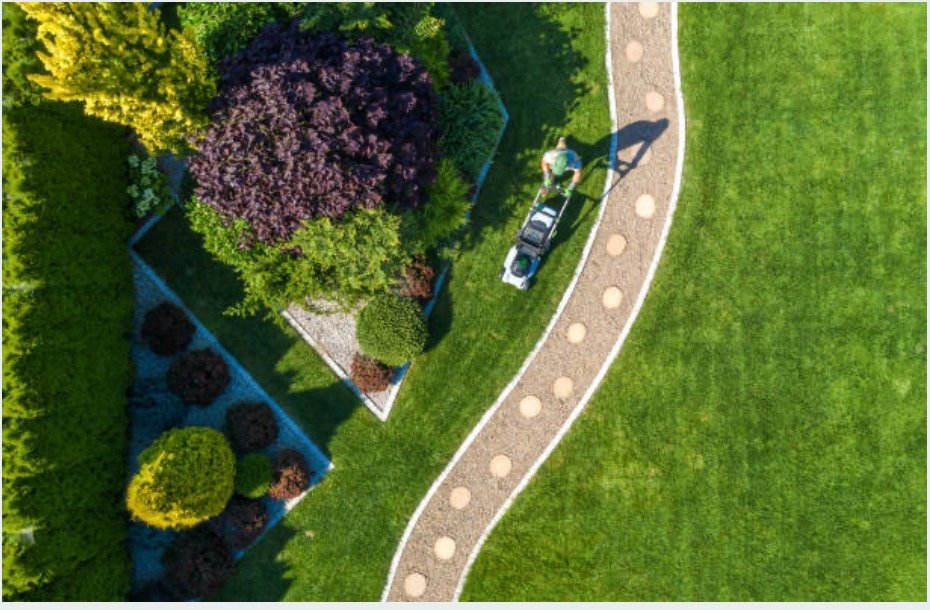 Aerial view of a curved stone walkway through layered garden beds