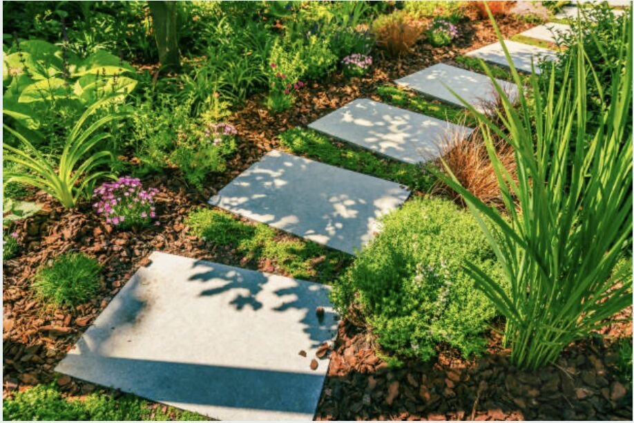 Stone walkway winding through a front yard